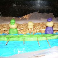 Rowing 2 rowers, a dog and a boat on the beach