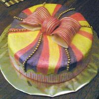 Gift Box this cake was painted with luster dust, and the bow is gumpasteIt was so easy and fun to make:)