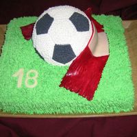 Soccer Ball butter cream cake with gumpaste scarf and numberit's my first ball