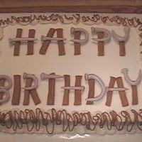 Pana0574.jpg White chocolate pudding cake with buttercream frosting and MMF lettering (my first try at MMF...or any kind of fondant for that matter).