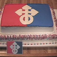 Pana0570.jpg Company logo cake for a business reunion. All in buttercream except BCT for white part of the logo.