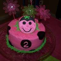 Ladybug Cake I used a sugar cookie for the ladybug face, black fondant for the spots and edible glitter to make it sparkle!! My little girl loved it!
