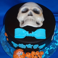 Halloween Baby Shower Chocolate cake with center layer of cheesecake. Baby shower for baby due on 11/1. They specifically asked for black fondant and a skull on...