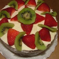 Almond Cake with cream cheese mousse topped with fresh fruit