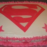 Supergirl_Birthday_Cake.jpg Supergirl. Strawberry cake with vanilla bc icing. Badge is made out of fondant.