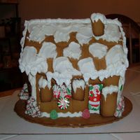 Gingerbread House I made this gingerbread cake for my table centerpiece. I added additional candy and gingerbread.