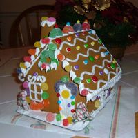 Gingerbread House I made this cake for a demonstration and I used the Wilton Gingerbread Kit. I added additional candy to make it look alittle more festive....