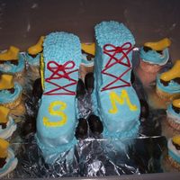 Schuyler's Roller Skates Client wanted Roller Skates w/ cup cakes, this is my 2nd carved cake and not to horrible I think?! The skates are choco,(this did not help...