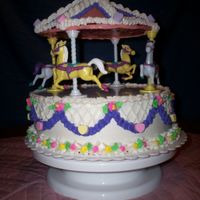 Margret's Merry Go Round This is a 2nd Birthday Cake, 3 Layer 10" chocolate round w/ mudslide chocolate and chocolate syrup filllings with all butter cream...