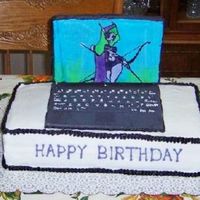 Laptop Cake the computer is made out of fondont the screen is a FBCT (world of warcraft picture) I piped all of the letters on the keyboard the cake is...