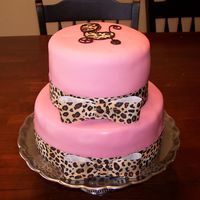 Carriage Baby Shower Cake baby shower cake with carriage and leopard print ribbon