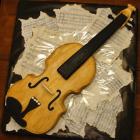 Viola This viola cake was for my brother's Senior Recital. It is covered in white fondant and painted with brown. The neck is styrofoam...