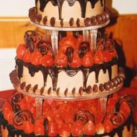 Chocolate Dream This cake has been done all in chocolate and strawberries. It can be used as either a wedding cake or a groom's cake.
