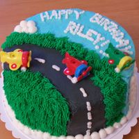 Airplane Runway Birthday cake for my friends' daughter who likes airplanes. Her grandmother found the airplane candleholders. There is a 4th one that...