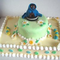 Baby Shower Cake This was my first time covering a cake with mmf. Only the top layer is covered though, the bottom is bc. The figurinesand flowers are made...