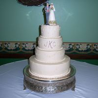 Ivory Wedding Ivory wedding cake for one of the nicest couples i have ever met. 6,8,10,12. Alternating simple floral design with brown accent behind the...