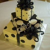 Polka Dot Wedding 6,10,14 squares iced in buttercream with fondant bows and accents. i purchased the wilton spray for the black layer, it did not work well....