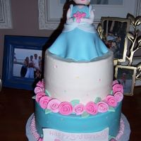 Cinderella Cake Made for a friends daughters birthday. I was going for a little girl version of cinderella. Buttercream with fondant figure (made over mini...