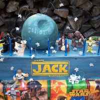 Jack's Star Wars Cake 18 inch half round pan, ball pan. buttercream with fondant stars. characters are action figures