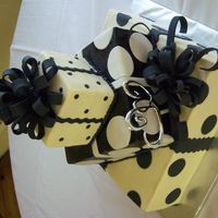 Polka Dot Wedding Black and white polka dots on 6,10,14 inch layers. frosted in buttercream, added fondant dots. bought the black spray in the can from...