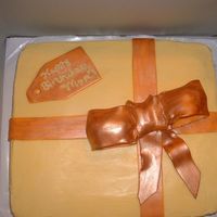 90Th Birthday This is a simple cake order for chocolate cake, tried to jazz it up for the 90th birthday girl, to look like a present. I chose not to...