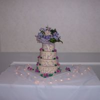 1St Wedding Cake First wedding cake 4 tier, gumpast roses along side, artifical top made, a bit to big, but it will look great on there table. All chocolate...