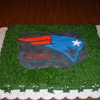 Superbowl Patriots Cake 1/2 sheet 1/2 chocolate, 1/2 vanilla, fondant center carved and decorated.