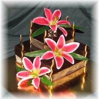 Kellie.jpg Two tiered mud cake for best friends 30th, star gazer lillies the highlight for meI have to learn to make smaller flowers