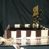 21St With Chocolate Panels chocolate mud cake covered with dark chocolate ganache and small white and dark choc panels, used a spangle that i cut down to size for...