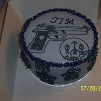 Berreta Cake This is an 8" double layer round Carrot Cake with crusting cream cheese icing and a Berreta Gun and logo. This was made for an...