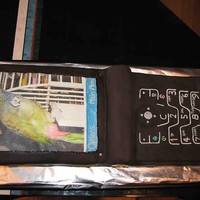 Cell Phone the cake is a replica of a cell phone and the background. the bird photo is an edible image, cake is about 36" long, covered in...