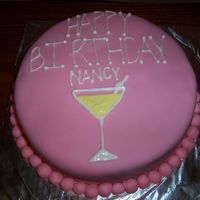 Nancy's Birthday Cake Birthday cake for my sister. German chocolate with chocolate icing, pink fonant and royal icing details