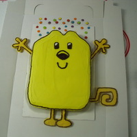 Wow Wow Wubbzy Cake I made this for my niece's 5th bday! the body is yellow cake with BC icing, the arms,legs, and tail are chocolate! she loved it:)