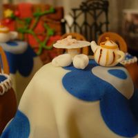 Secret Garden Tea Party Tables are made from standard size cupcakes, covered in fondant. Chairs are mini-cupcakes also covered in fondant with gumpaste backing....