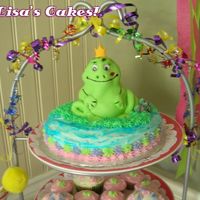 Froggie Prince Charming My 1st attempt at fondant. I'll think I'll just wait for the class! :) Bottom cake I iced "rough" to look like water in...