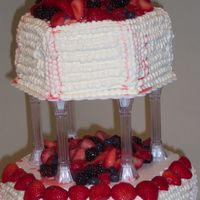Megan's Wedding Ii This is the top of the cake. Inbetween the pillars and on top was fresh fruit. As you can see, it runs a little. It added to the uniqueness...
