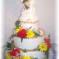 Wedding Cake Country Style This Wedding cake was white 12 in, choc 10 in ,and white 6 in with butercream and choc buttercream borders and then the fresh flowers the...