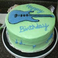 Guitar1.jpg Lemon pound cake (recipe from cake central) with frozen buttercream transfer of guitar. The music notes around the side are a bit hard to...