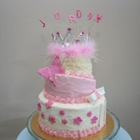 Princess Birthday Cake my friends daughter wanted to be a princess, so I made a princessy cake. Caramel, White and Chocolate mudcake layers with buttercream icing...