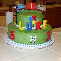 Thomas The Tank Engine I made this for my oldest sons 3rd Birthday. The trains were found at Target, everything is buttercream. In hindsight, I would have iced...