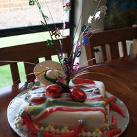 A Fiesta Party Cake this was a mexican themed fiesta cake.Sugarpaste icing chillis, and accents, it was such a short notice cake or I would have made the...