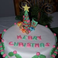 2005 Christmas Fruit Cake This is a cake i made for my family for this years christmas, a fruit cake was made a few months ago, and i covered it with sugarpaste. A...