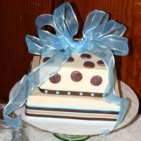 Baby Shower Cake We made this spice cake with BC, ribbon and fondant accents for our friend's baby shower.