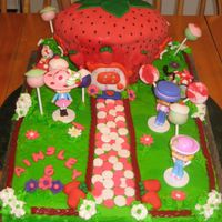 Strawberry Shortcake I want to thank Kassie73 for this cake design! My niece asked me to make her a strawberry shortcake cake including her hello kitty figure...