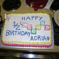 Ok Picture Of Overall Cake 1/2 Yellow Cake; 1/2 Chocolate Cake; BC; no fillingI was late leaving, so this is my best picture of the overall cake. It was for my Godson...