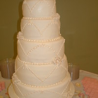 Antique Rose Wedding Cake Fun, and challenging at the same time! 15,13,11,9,7 inch tiers, all fondant. Gumpaste roses, piped beaded garland and then detals brushed...