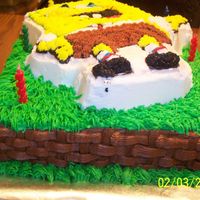 Sponge Bob Cake Side View Did this for a 3year old's birthday party. I use the tio to do grass all around sponge bob, and did basket weaving around the sides...