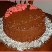 Chocolate Birthday Cake.mmmmmm This was a 10" double layer 2" each....chocolate buttercreme filling and icing...the roses are MMF... I just love that stuff.......