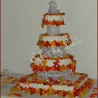 Jessica & Jake's Wedding Cake OK,bottom cake is two 1/2 sheetcakes, one chocolate, one yellow..next one up is white, then yellow on the last two cakes...It turned out...