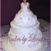 Holly's Bride Doll Cake I did this for my daughter's bridal shower last yr. The layers are 12" 10" and a single layer 8" under the doll cake it...